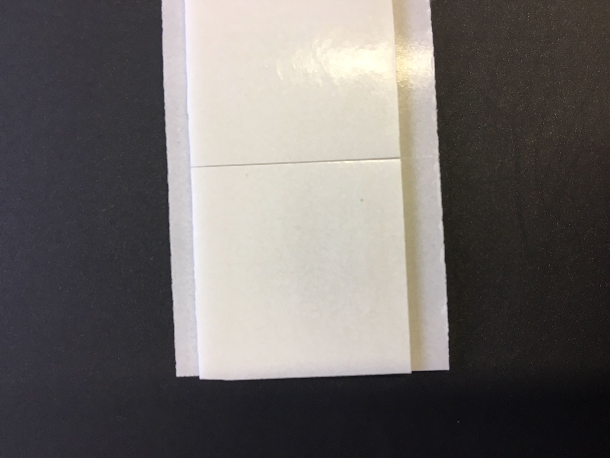 Strip of 10 25mm Square double sided sticky pads.